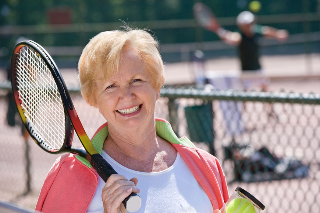 Senior lady playing tennis